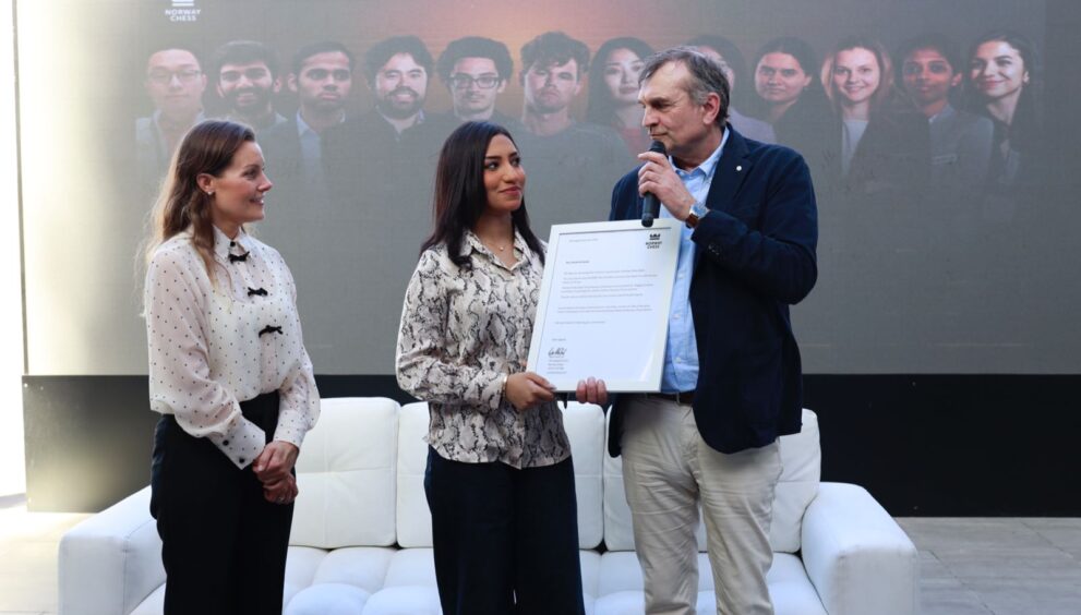 Kjell Madland, Managing Director of Norway Chess, presents the official invitation to participate in the Norway Chess Open 2025 to Rouda Al Serkal, the UAE’s first Woman Grandmaster, as Benedicte Westre Skog, COO of Norway Chess, looks on during the official press conference held at the Seven Seas Hotel in Dubai on Wednesday. Photo Credit: Joy Dasgupta/Norway chess