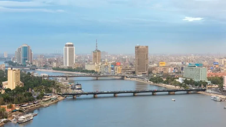Cairo skyline featuring the Nile River and Al Baraka Bank.