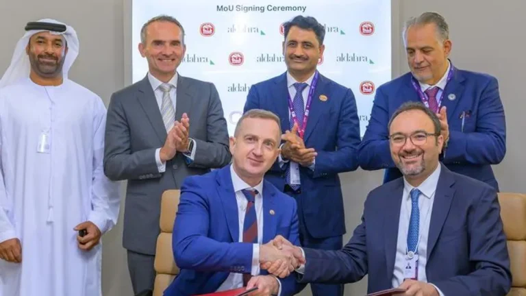 Executives from Baladna and Al Dahra sign a memorandum of understanding in Abu Dhabi.