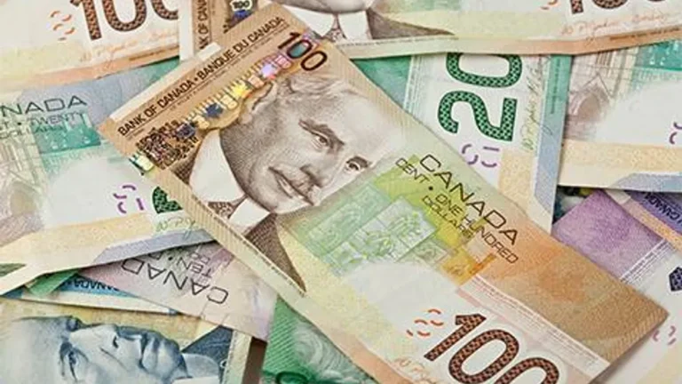 Canadian dollar notes with a backdrop of fluctuating stock market graphs.