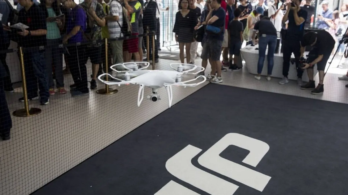 Empty DJI store in Beijing with shelves devoid of drones and accessories.