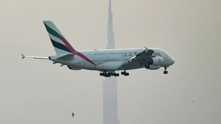 Dubai International Airport bustling with passengers and aircraft.
