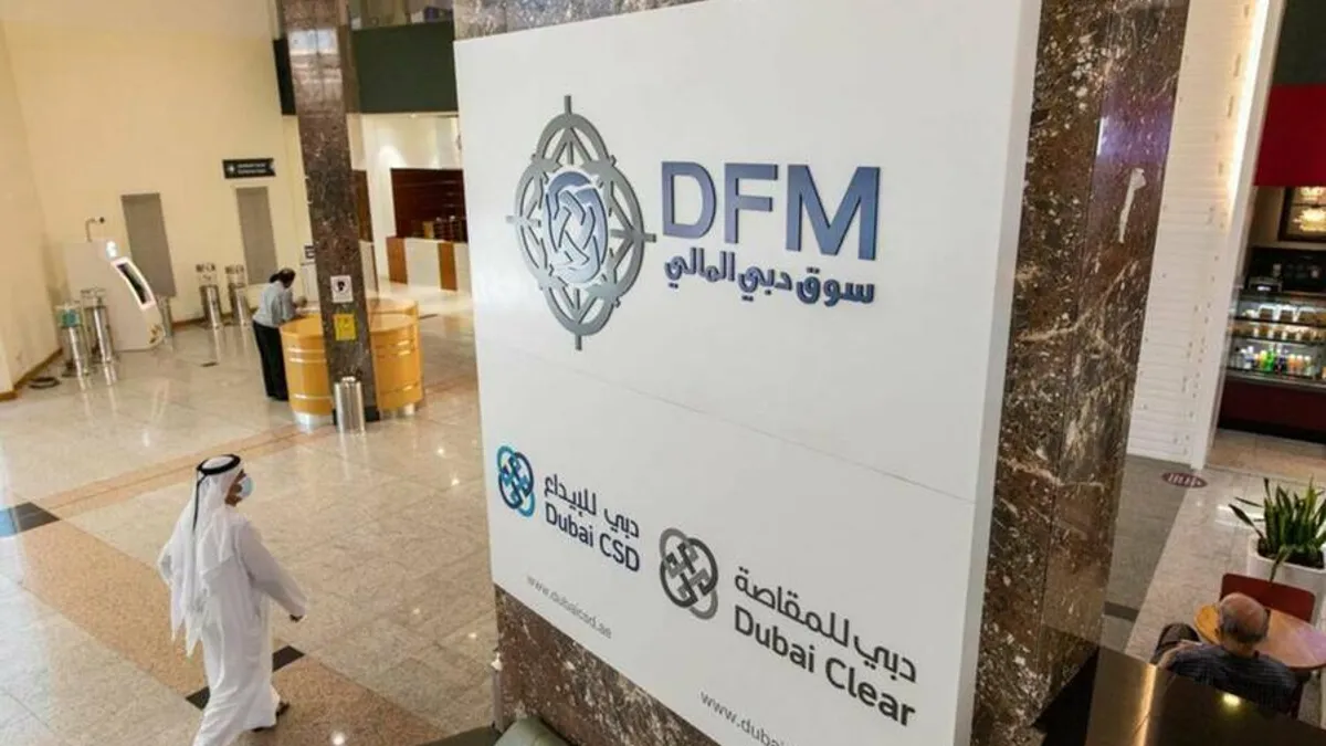 Dubai Financial Market trading floor bustling with investors and activity.