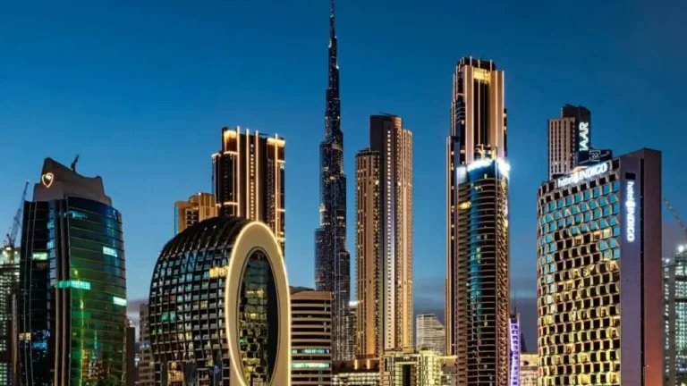 Construction site of Dubai's new metro line with cranes and workers.