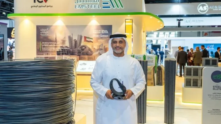 EMSTEEL Group representatives receiving the Quality and Compliance Award at a ceremony.