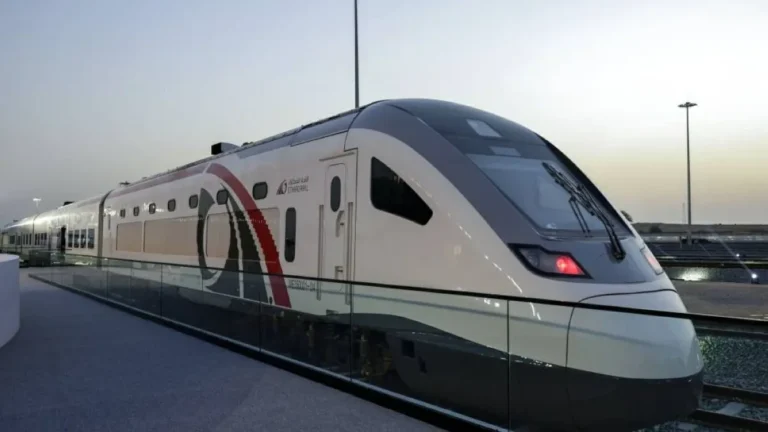Freight train transporting goods across the UAE landscape.