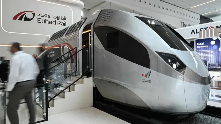Freight train on the Etihad Rail network transporting goods in the UAE.
