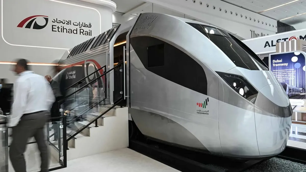 Freight train on the Etihad Rail network transporting goods in the UAE.