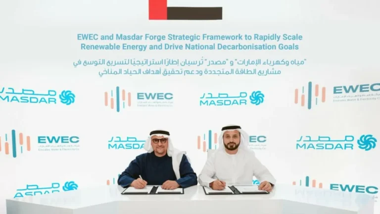 Executives from EWEC and Masdar sign a collaboration agreement for renewable energy projects.