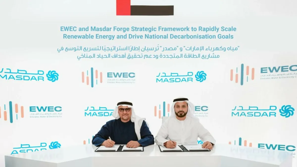 Executives from EWEC and Masdar sign a collaboration agreement for renewable energy projects.