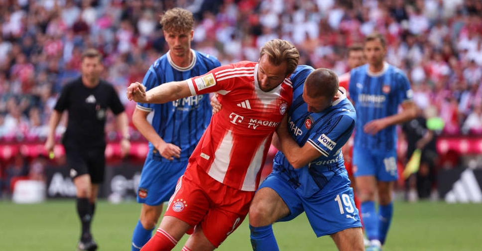 Bayern Munich players celebrating a late equalizer during a Bundesliga match.
