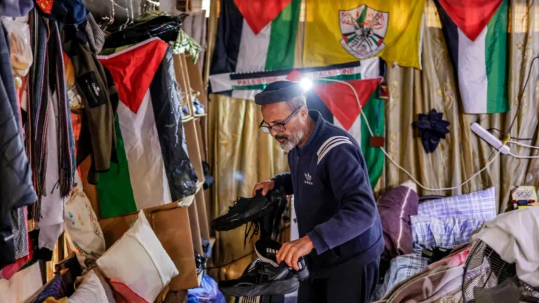 Gaza residents living under bleachers in Nablus stadium, facing difficult conditions.