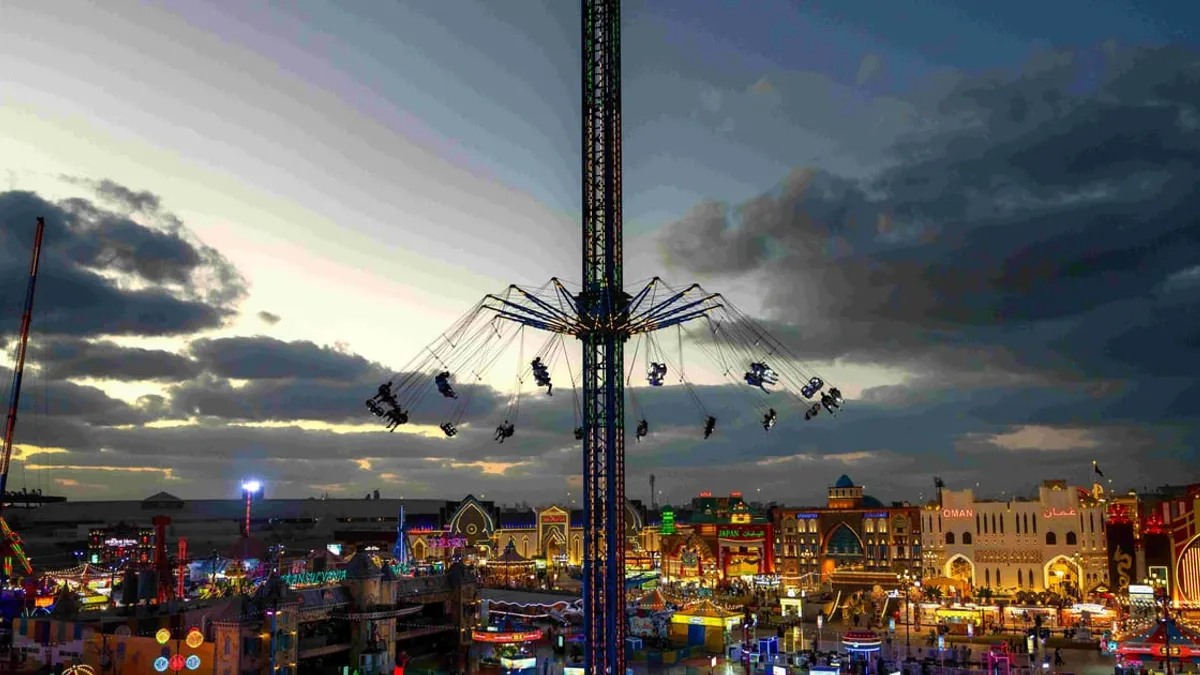 Families enjoying entertainment at Global Village in Dubai.