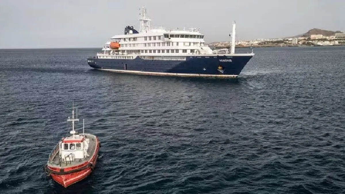 Cruise ship MV Hondius anchored near Tenerife with health authorities monitoring the situation.