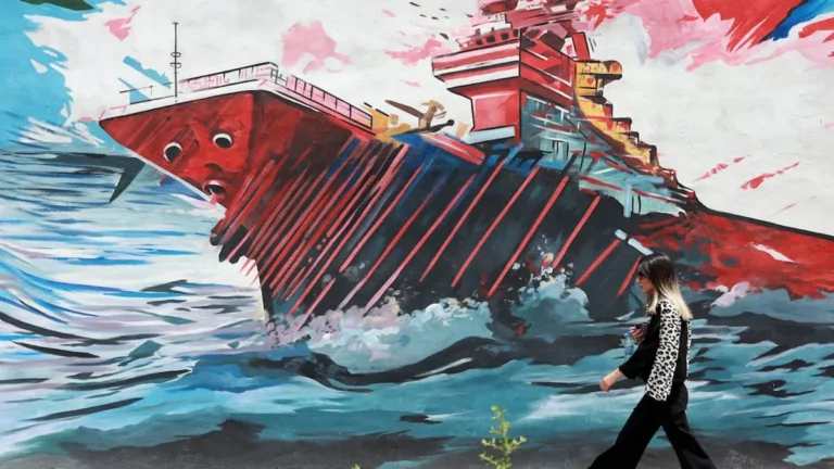Ships navigating through the Strait of Hormuz amidst geopolitical tensions.