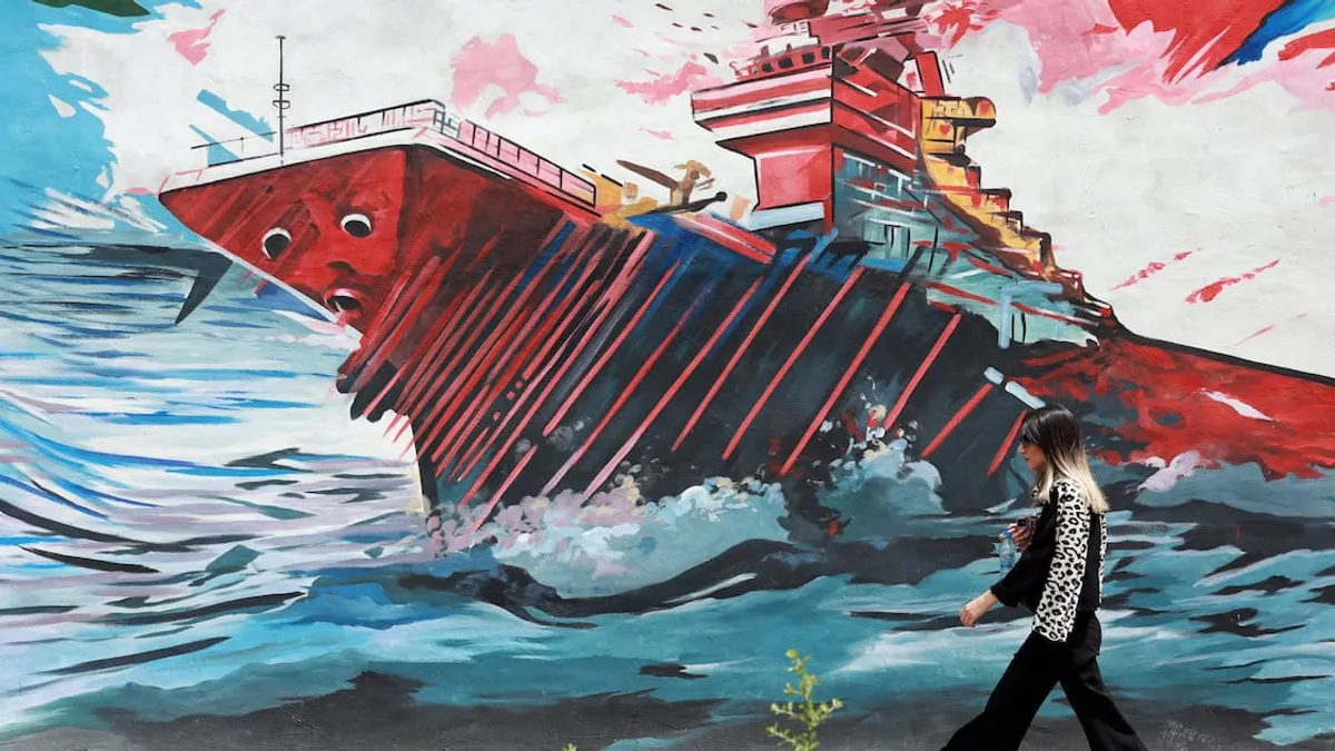 Ships navigating through the Strait of Hormuz amidst geopolitical tensions.