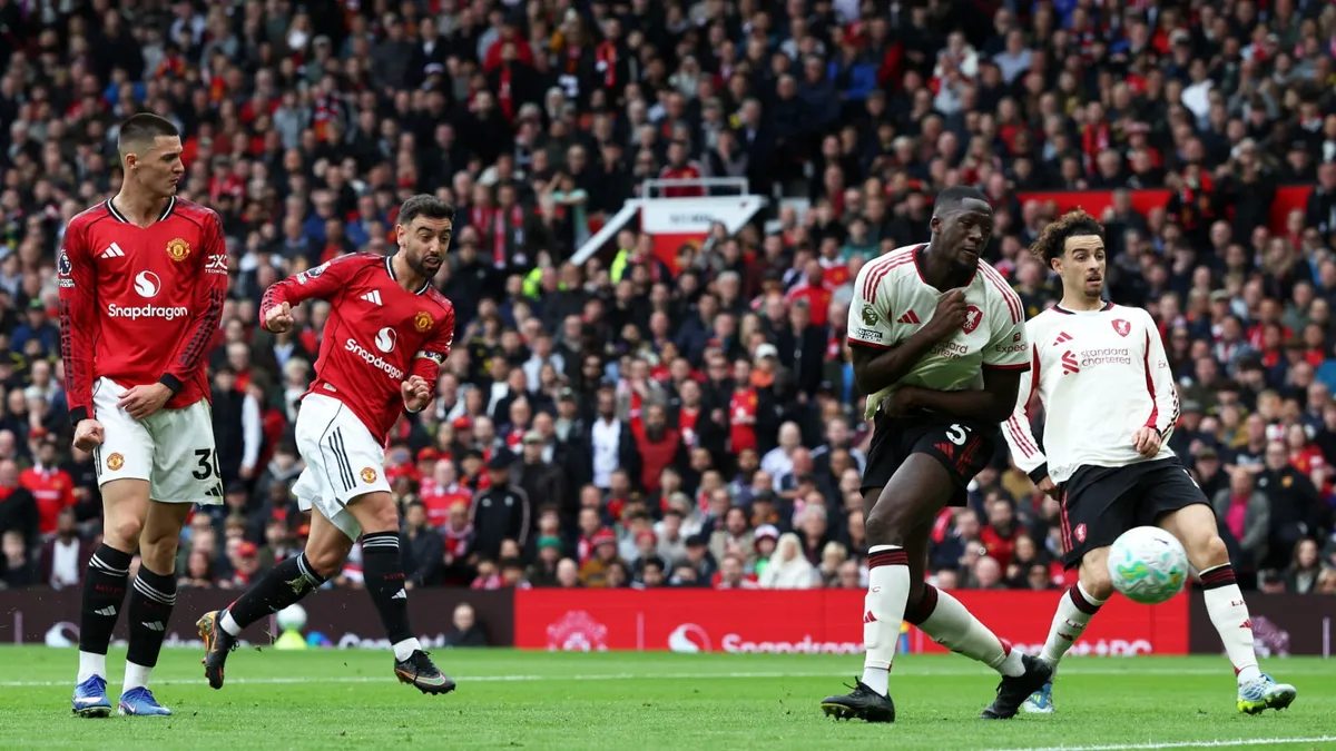 Manchester United players celebrating a goal against Liverpool during the match.