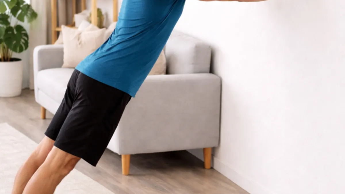 An elderly person performing simple strength exercises at home.