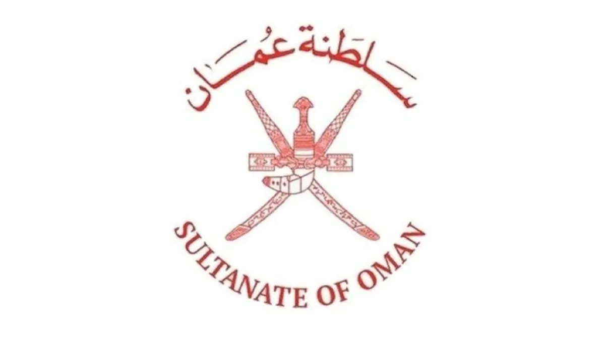 Damage to a residential building in Oman after an attack, with emergency services present.