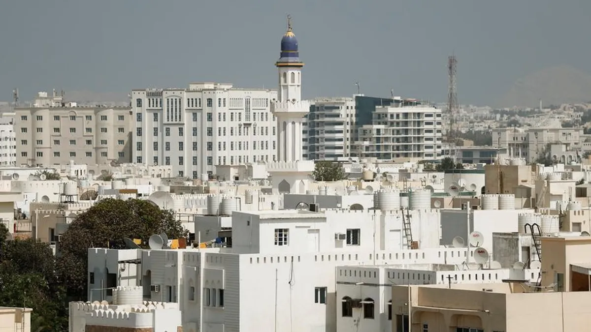A view of Oman's infrastructure and natural beauty promoting tourism and investment.
