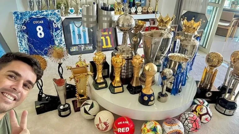 Brazilian footballer Oscar showcasing his trophies and jerseys from Messi and Neymar.