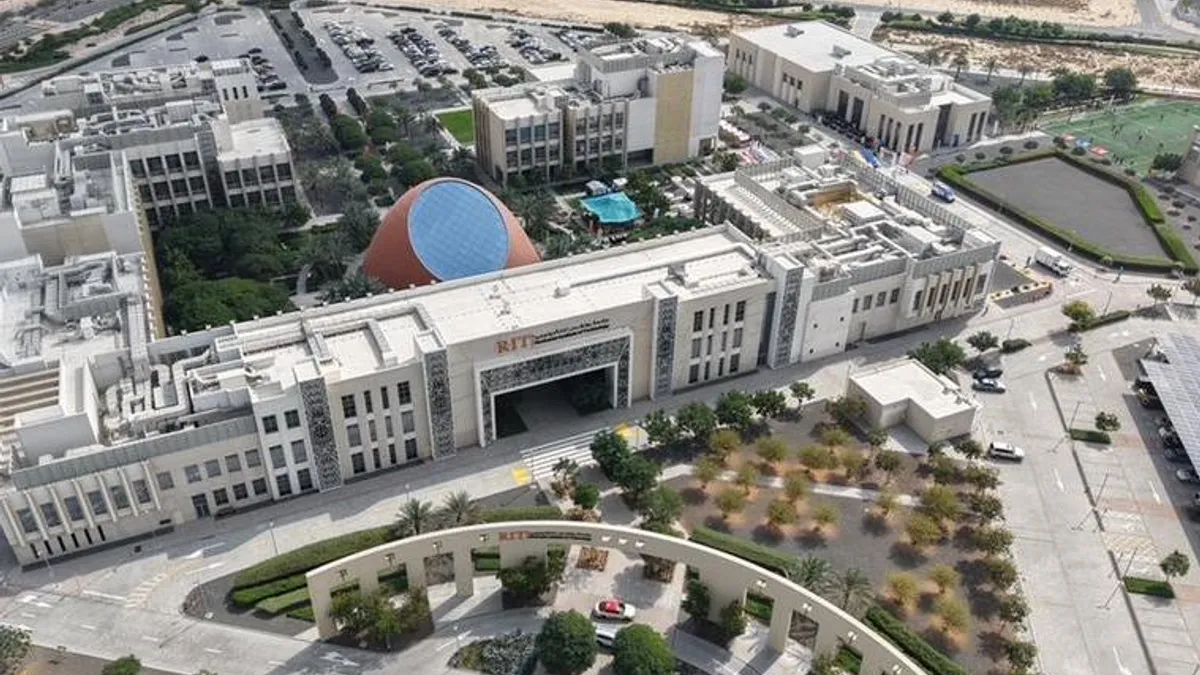 Students engaging in technology and business studies at RIT Dubai's new campus.