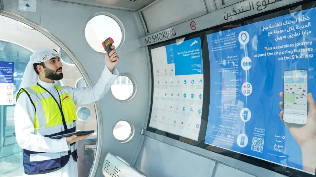 RTA inspectors checking air-conditioned bus shelters in Dubai.