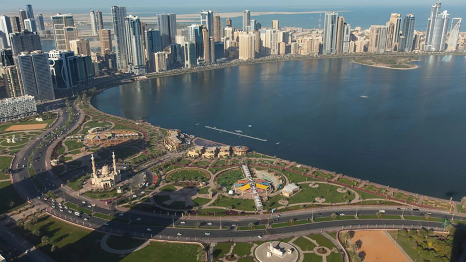 Visitors enjoying various activities at Sharjah Waterfront Promenade.
