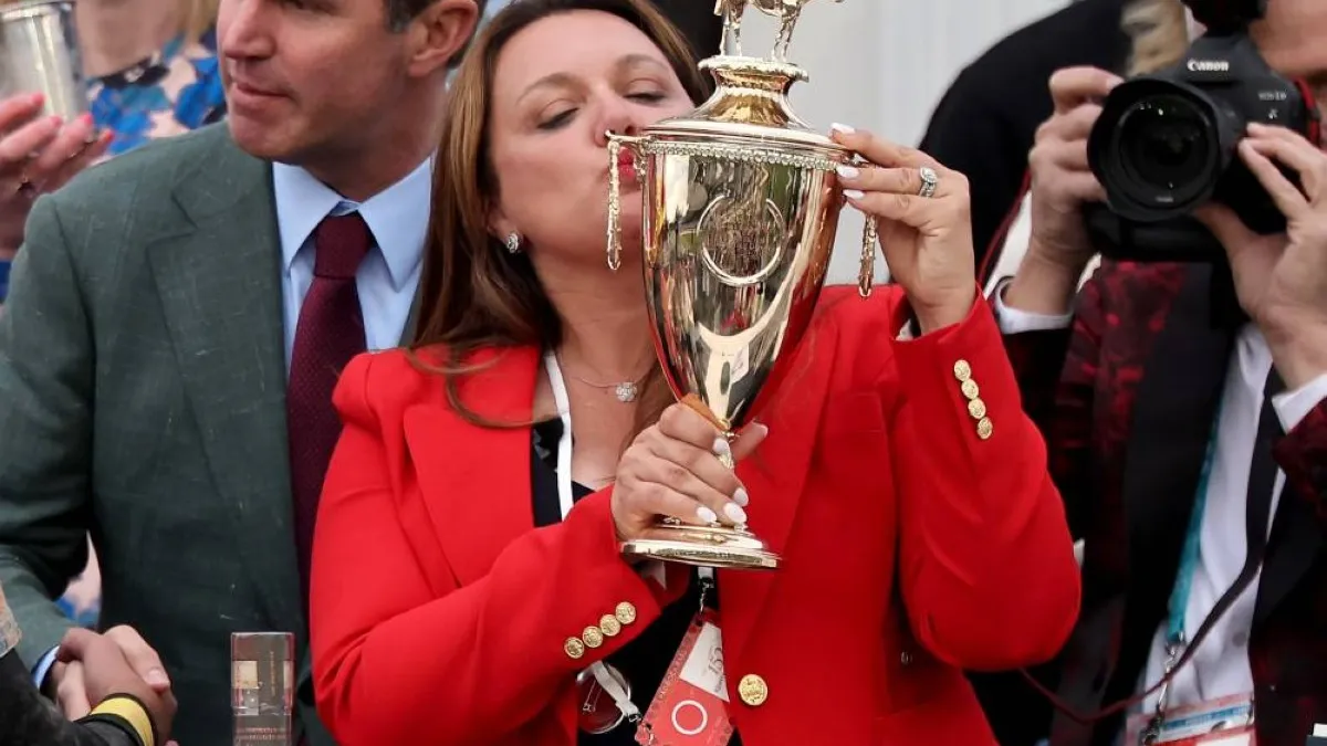 Sherry DeVoe celebrating her historic Kentucky Derby victory with Golden Tempo.