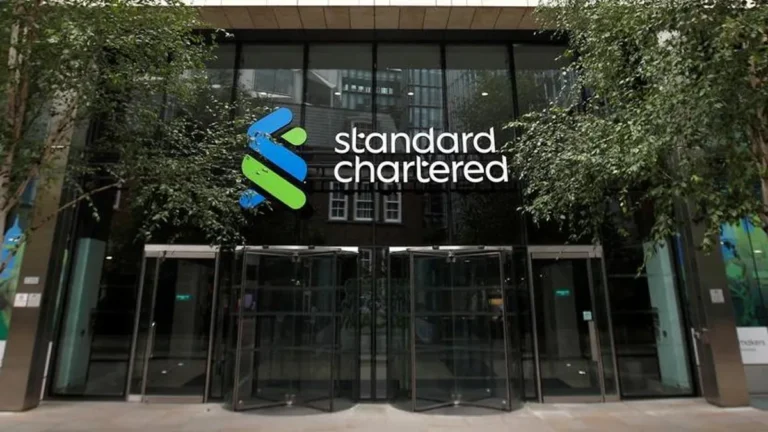 Standard Chartered Bank logo with Dubai skyline in the background.