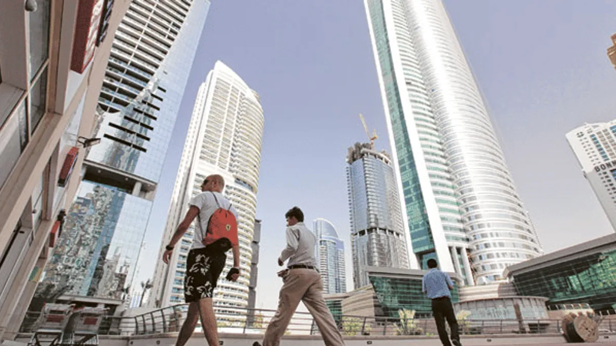 Business professionals discussing e-invoicing implementation in Dubai.
