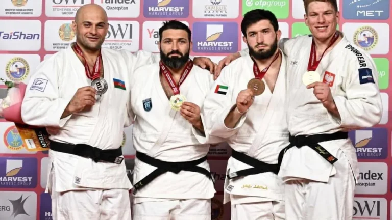 UAE judo team celebrating their achievements at the Astana Grand Slam.