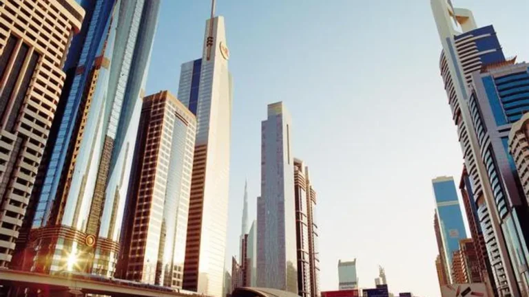 Aerial view of Dubai's skyline with economic activity indicators.