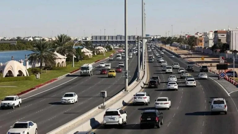 A variety of vehicles parked in a UAE registration facility.