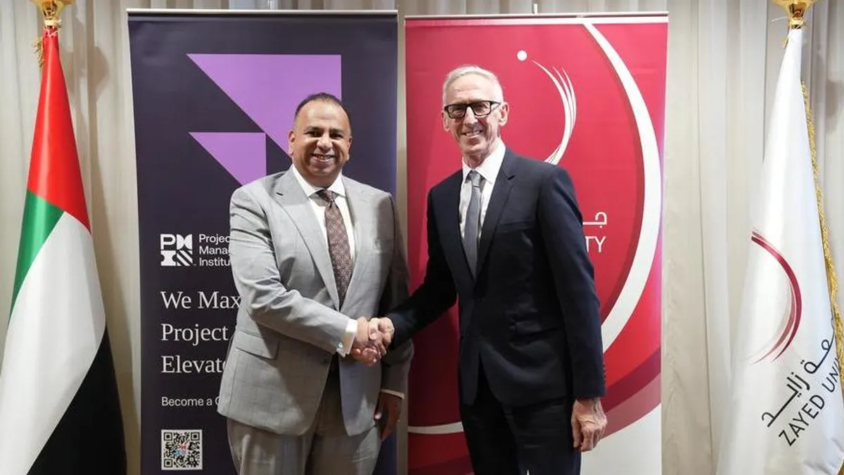Zayed University and PMI executives signing the Memorandum of Understanding.